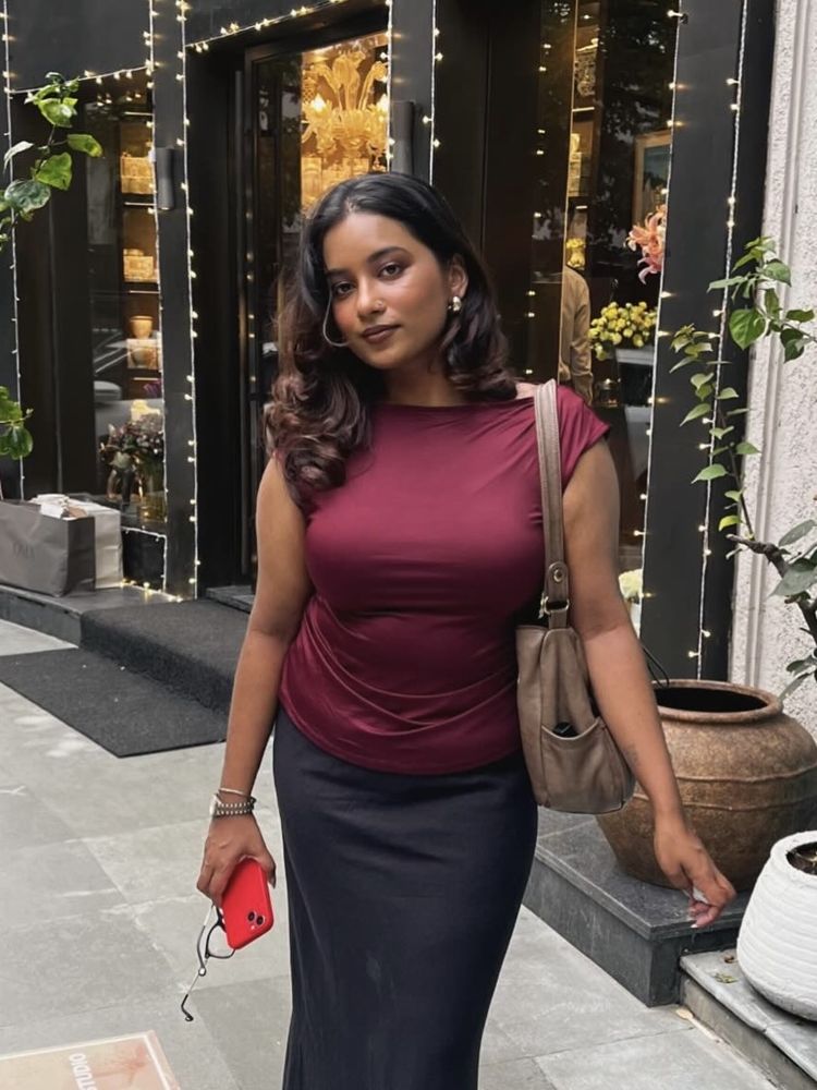 Dr. Charuta Pradeep in a burgundy top