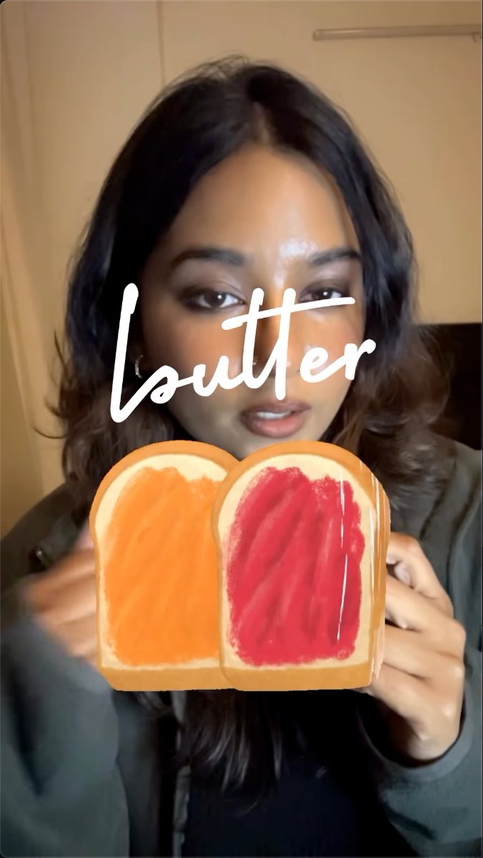 Still from the sandwich Reel, holding two slices of toast